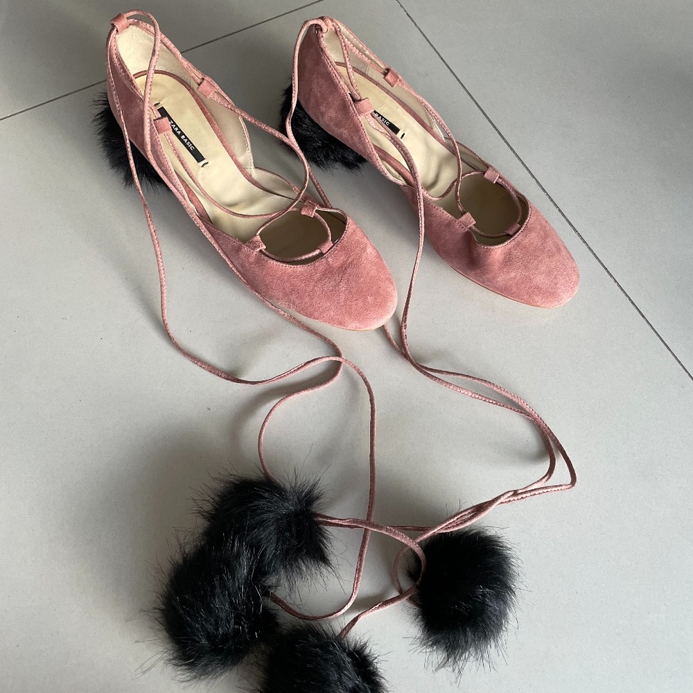 Pink suede ballerinas with pom poms